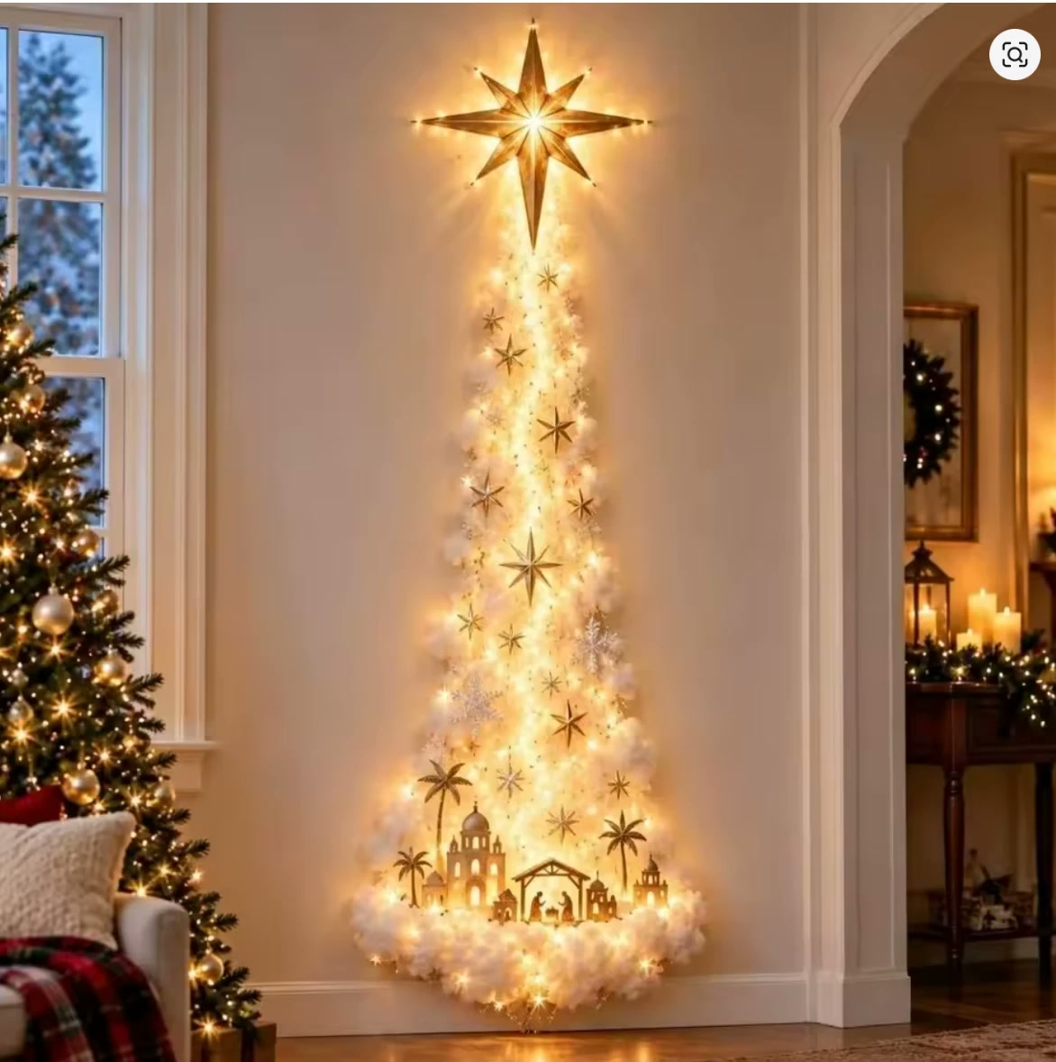 Starlight Snow Trail Wall Light glowing on a living room wall beside a Christmas tree